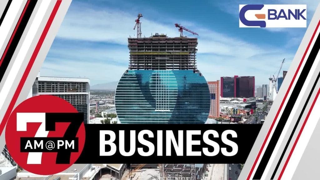 A modern glass building under construction with cranes on top, framed by bold graphics reading "7@7 AM@PM BUSINESS" and a "BANK" logo in the corner.